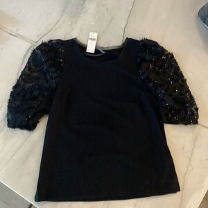 NWT Anthropologie black top with embellished puff sleeves. Size small